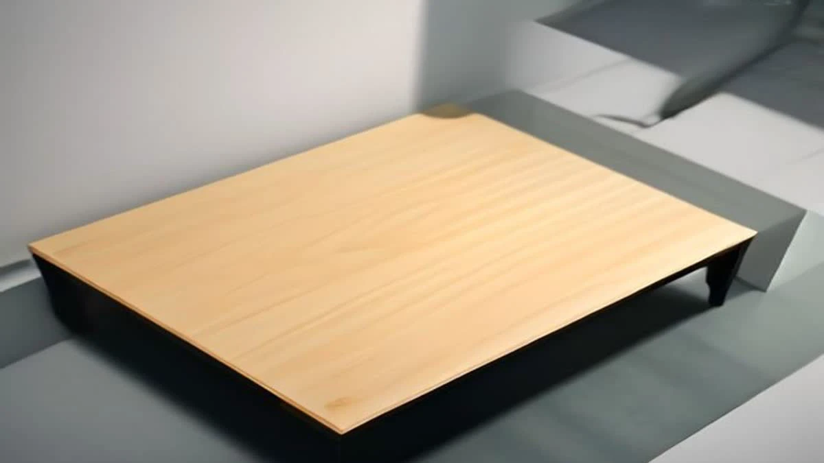 top-down flat lay of a bright minimal desk with a laptop and a smartphone showing an abstract rising line chart